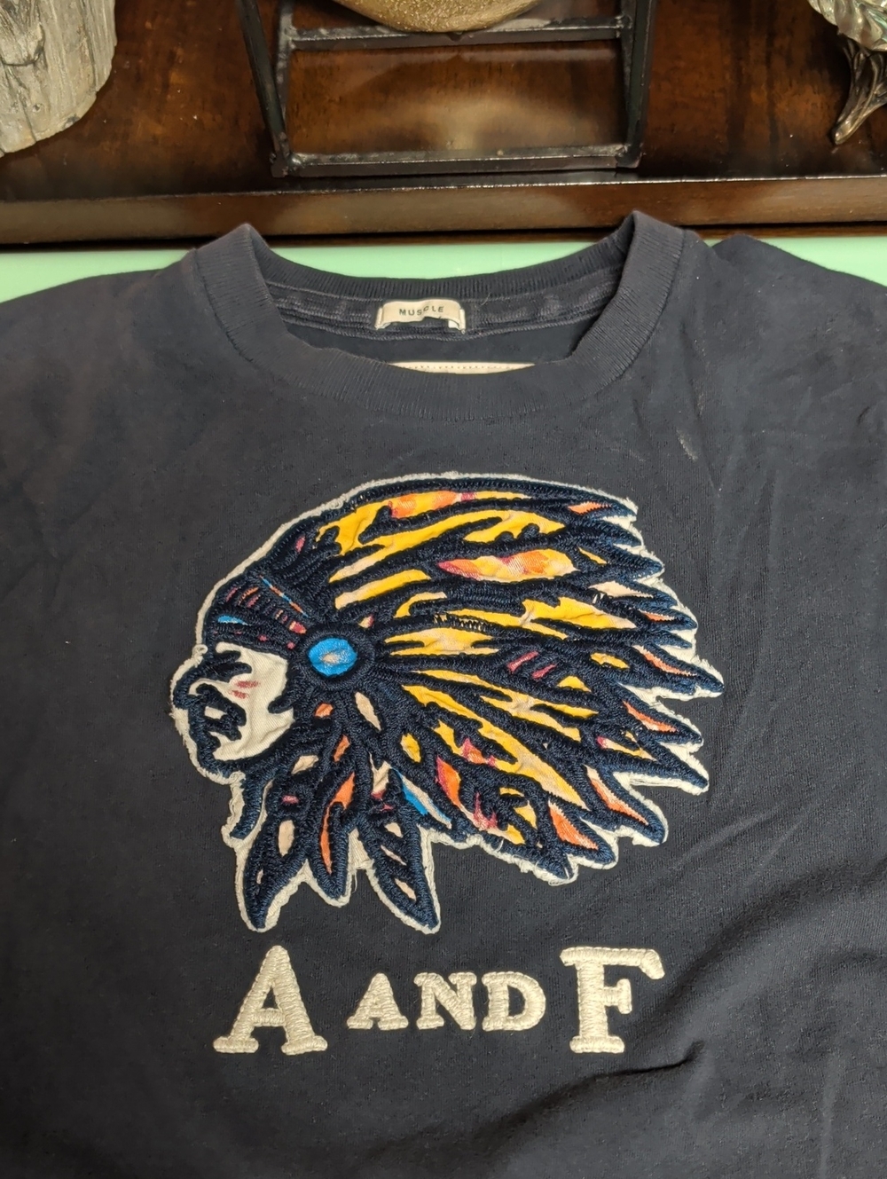 A and F  Navy Graphic Tee with Colorful Headdress Fits Like A Medium